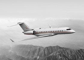 VistaJet Global 5000 flying over mountains