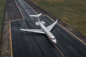 Birds eye view of a VistaJet on a runway