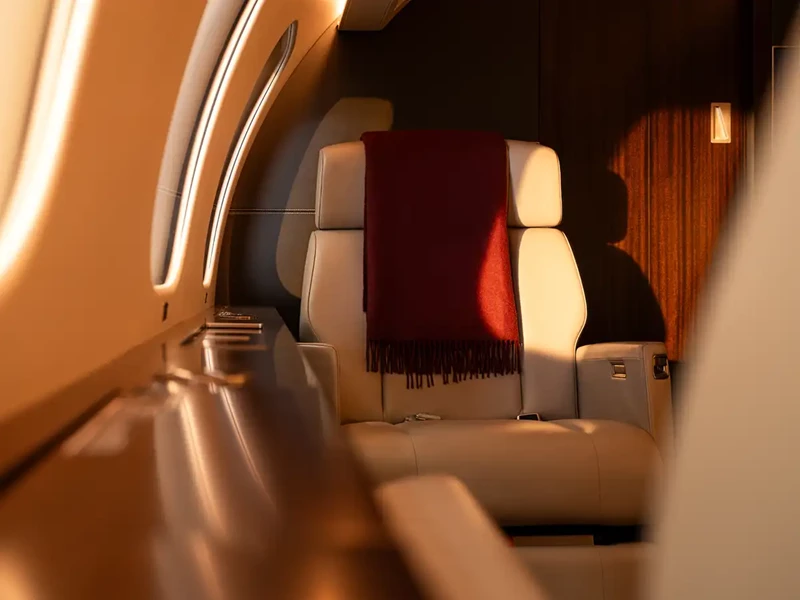 VistaJet Bombardier Global 8000 seating behind a cockpit
