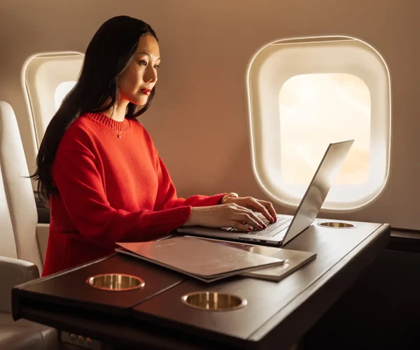 Member using a laptop on a VistaJet