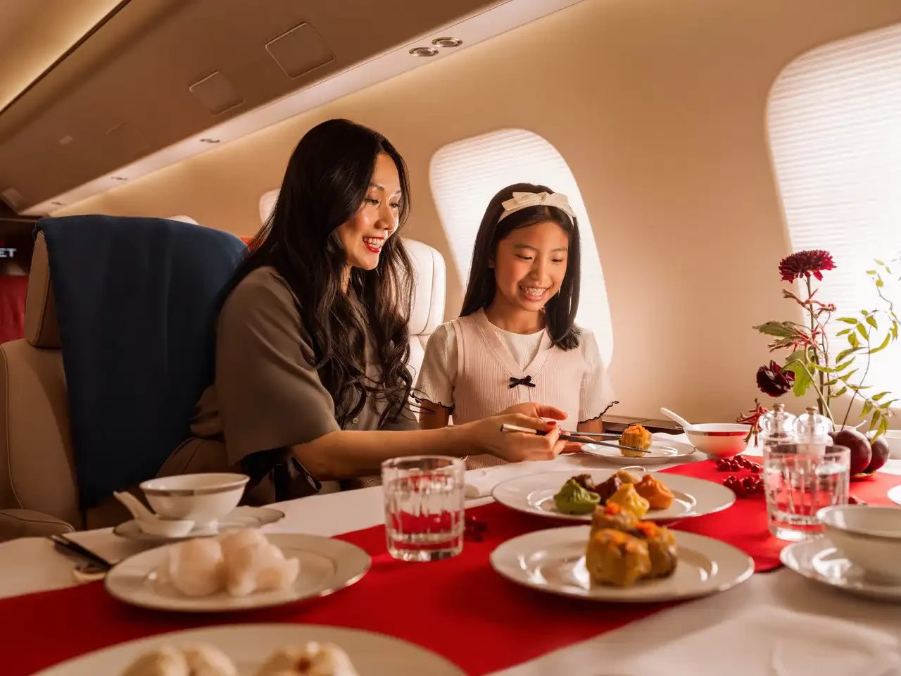 A family enjoying Private Dining with VistaJet as they fly with complete anonymity.