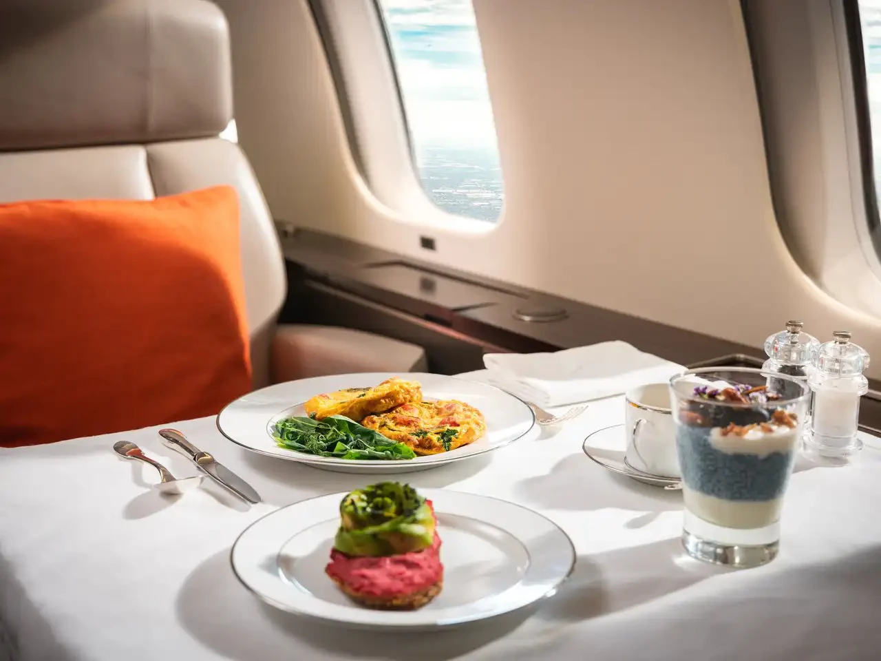 A Private Dining meal, an example of a sophisticated on board amenity that is designed to create a comfortable and personalized in-flight experience