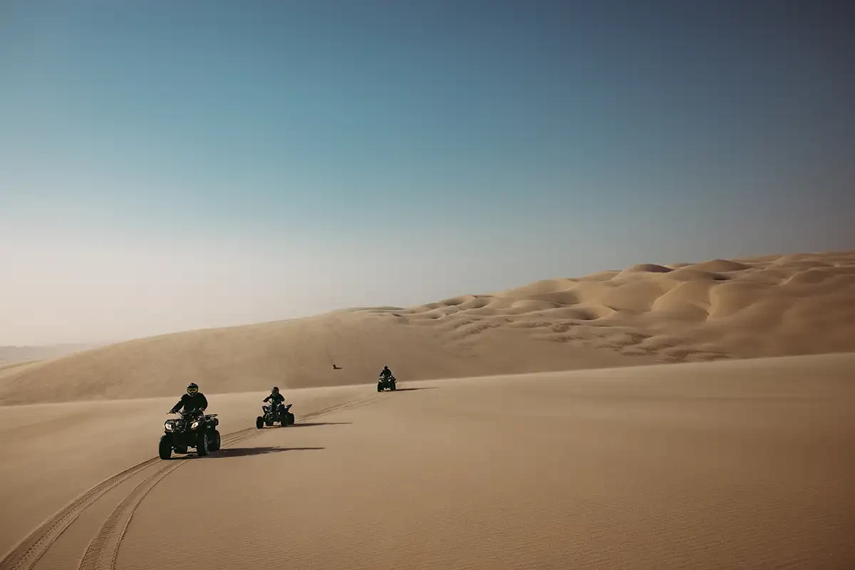 The Fife A number of people on Quad bikes driving in the desert