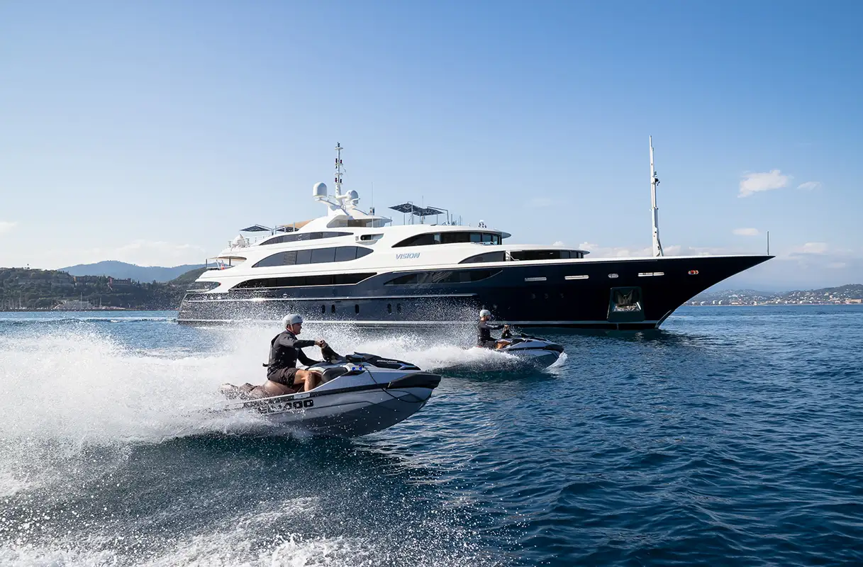 Clients on Jet Ski in front of yatch