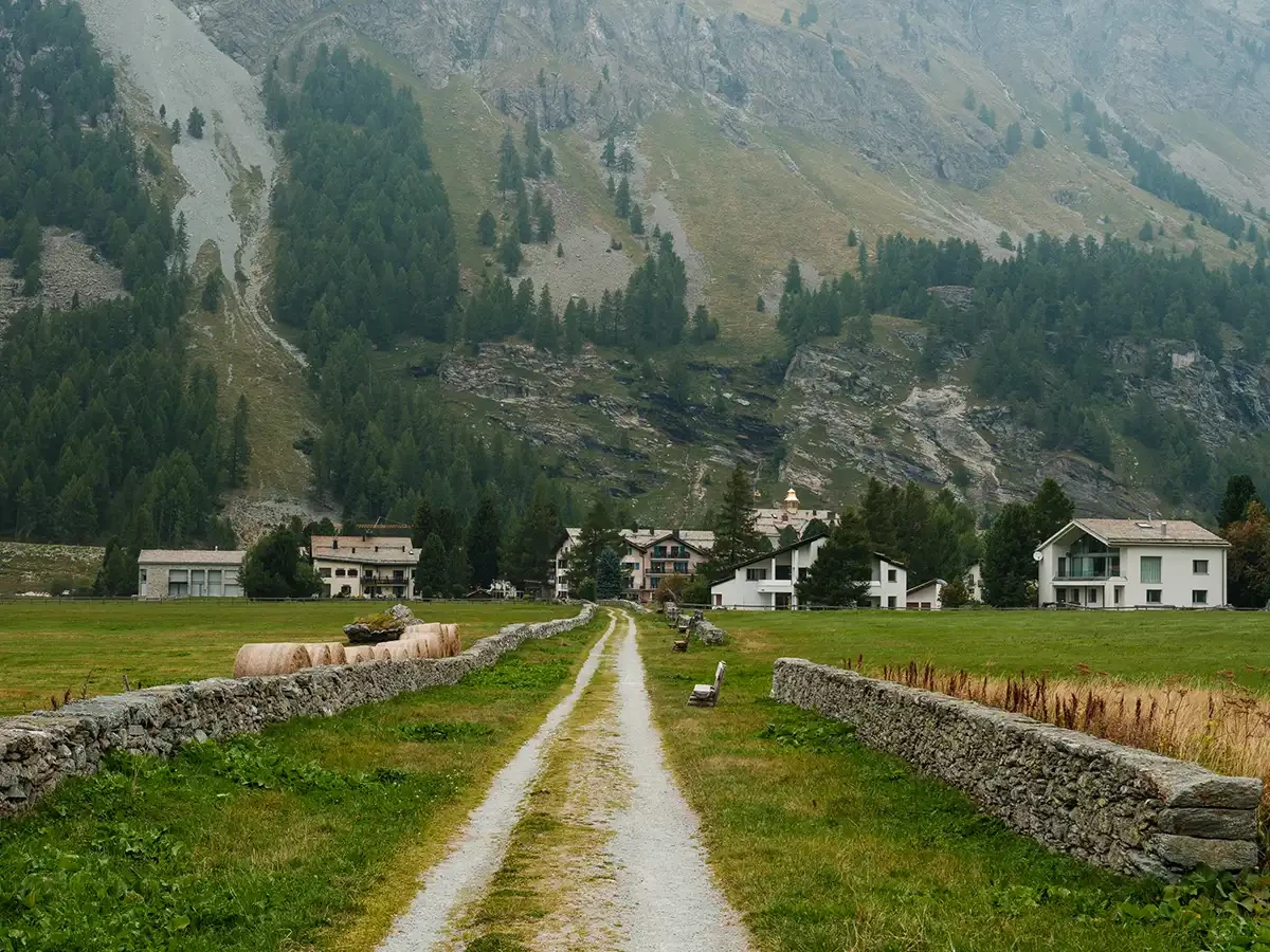 A Village in Chesa Marchetta that sits below the mountains 
