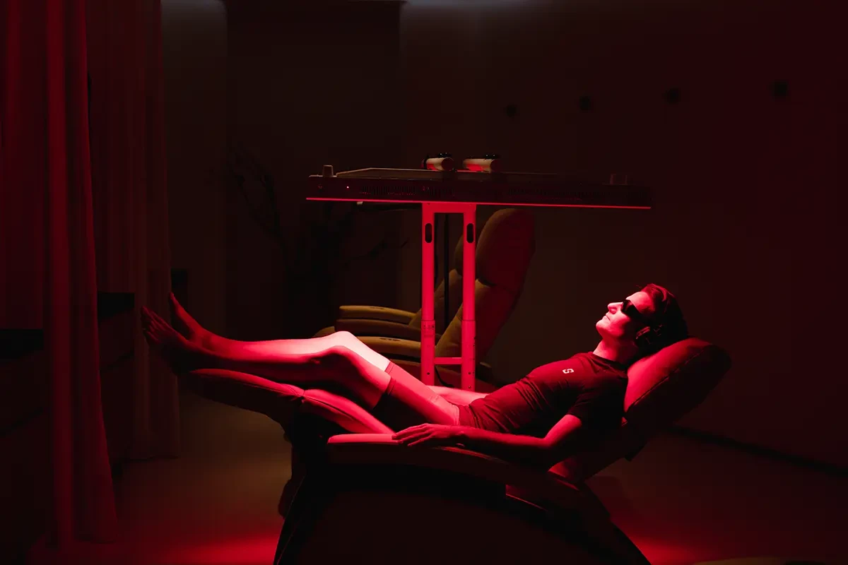 Client having red light treatment
